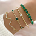 4-delige set van smaragdgroene kristallen en gouden armbanden