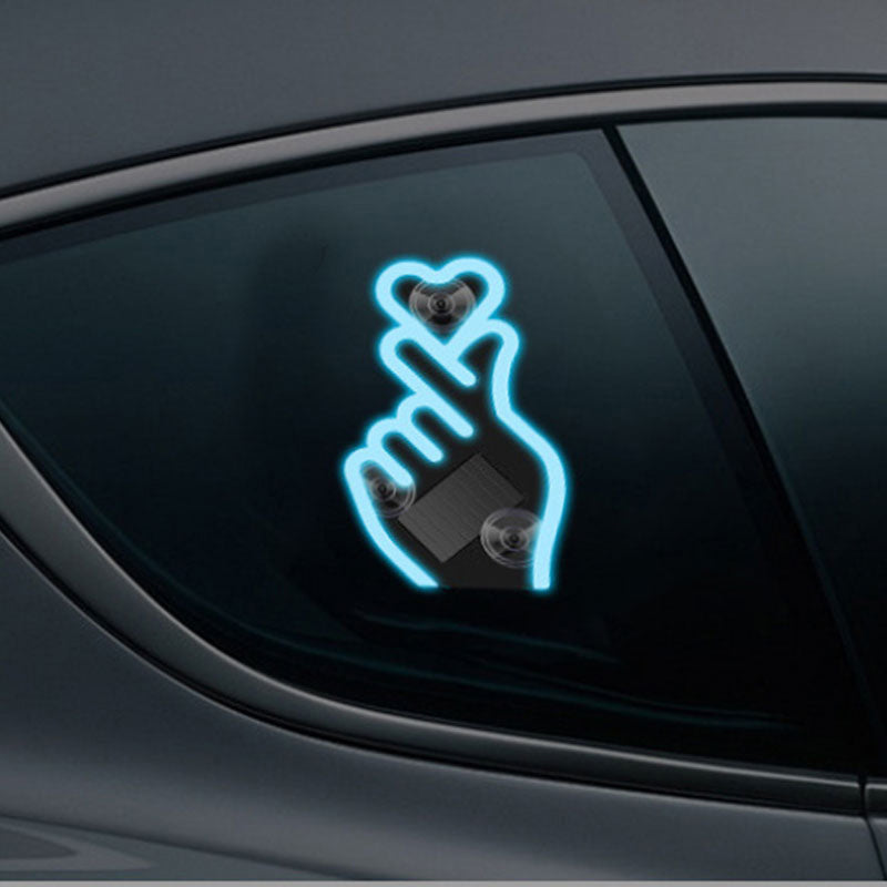 🚗💡 Laat je auto liefde uitstralen💖 Nieuwjaarsactie: Zonne-energie LED Autolamp – Vingerhart Design -50%